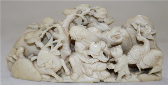 A Chinese ivory figural brush rest, 18th century, length 9.7cm